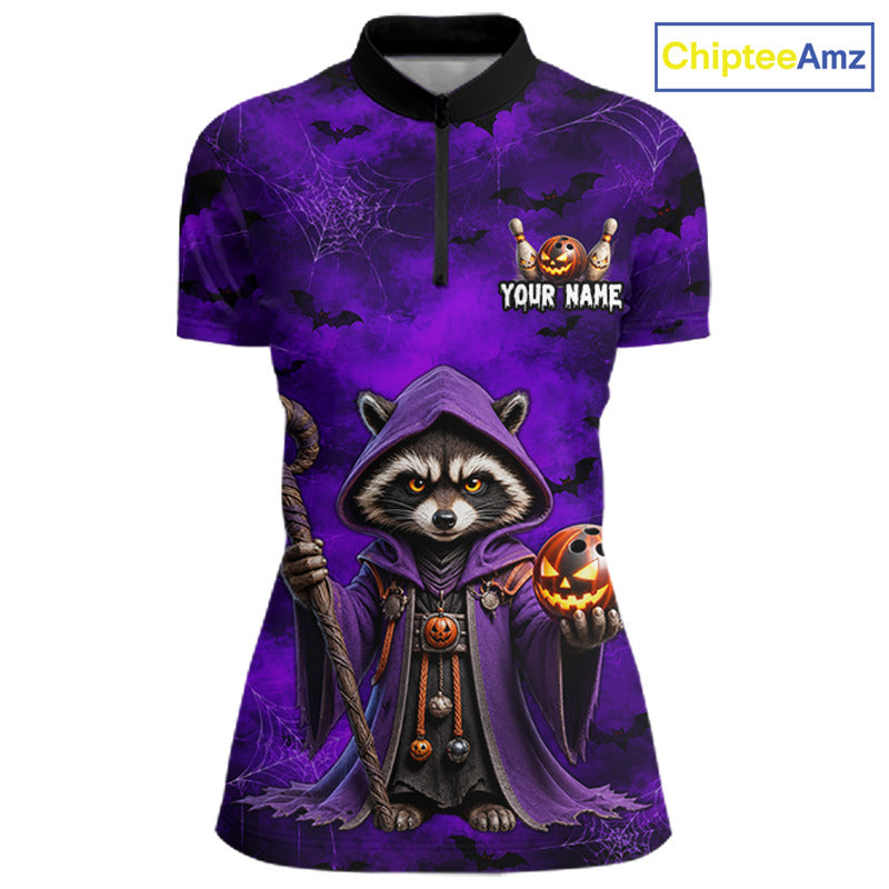 A short-sleeve polo shirt with a Halloween-themed graphic print featuring a raccoon in a purple hood holding a jack-o'-lantern, set against a purple spiderweb background. The shirt has a black collar and a black half-zip at the neck, with a customizable text placeholder reading 'YOUR NAME' on the chest.