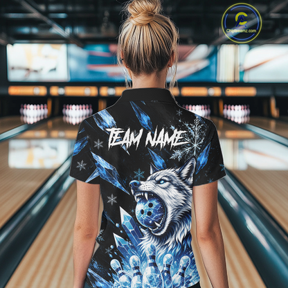 Person wearing a black shirt with a wolf design and 'TEAM NAME' text in a bowling alley.