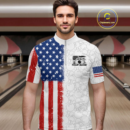 A man wearing a short-sleeve bowling jersey with a split American flag design, standing in a bowling alley. The left side of the shirt features a distressed red, white, and blue American flag pattern, while the right side is white with a subtle bowling ball pattern.