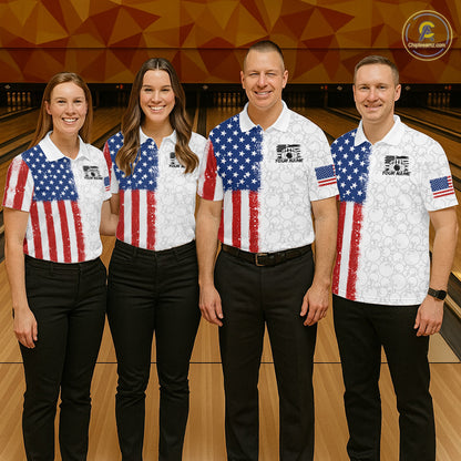 Four people standing together in a bowling alley wearing matching white bowling shirts with an American flag design, paired with black pants. The shirts feature a blue star field on the upper chest and red-and-white vertical stripes below, with a small US flag on the sleeve.