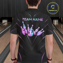 Load image into Gallery viewer, Person wearing a black bowling shirt with colorful design and 'TEAM NAME' text in a bowling alley.