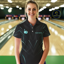 Load image into Gallery viewer, Woman wearing a black bowling shirt with gold accents in a bowling alley.