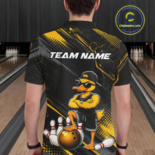 Load image into Gallery viewer, Person wearing a bowling-themed shirt with a duck graphic in a bowling alley.