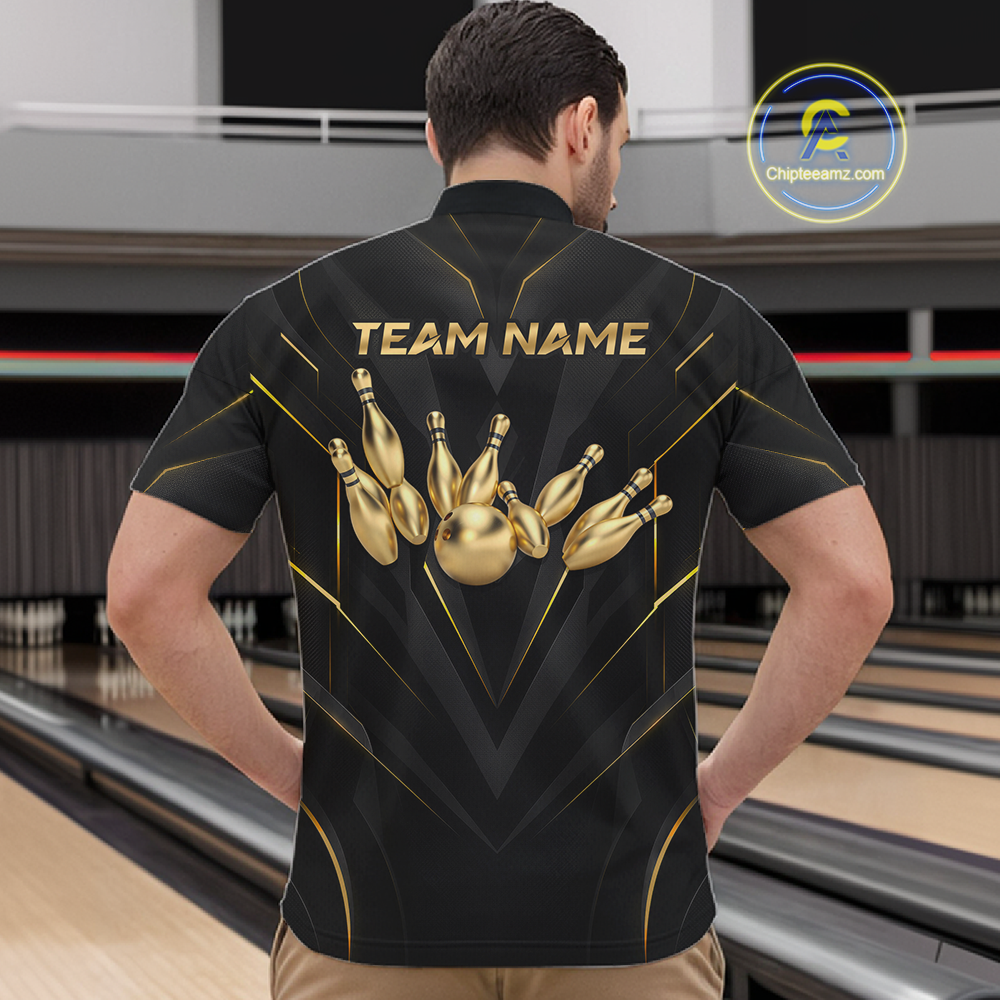 Man wearing a black bowling shirt with gold designs and 'TEAM NAME' text in a bowling alley.