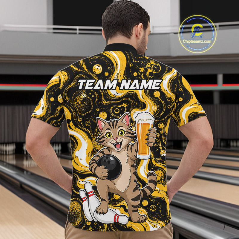 A man viewed from behind wearing a bowling-themed short-sleeve shirt with a cartoon cat holding a bowling ball and beer glass, set against a bowling alley background. The shirt features a black and yellow marbled pattern with 'TEAM NAME' printed across the upper back.