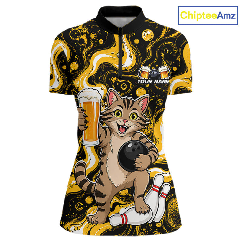 A short-sleeve polo shirt with a black and yellow abstract background pattern, featuring a cartoon tabby cat bowling with a bowling ball and pins, holding a beer glass. The shirt has a black collar, a half-zip neckline, and 'YOUR NAME' printed on the chest.