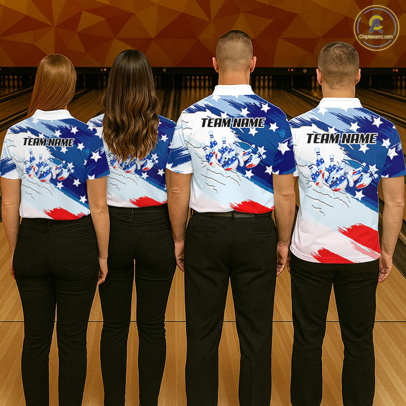 Four people standing with their backs to the camera in a bowling alley, wearing matching bowling shirts with a patriotic American flag design featuring blue, white, and red stripes and stars, along with black pants.