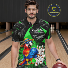 Load image into Gallery viewer, Man wearing a colorful bowling shirt with a parrot design in a bowling alley.