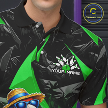 Load image into Gallery viewer, Black and green polo shirt with a logo and text on a dark background