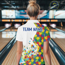 Load image into Gallery viewer, Back view of a female bowler wearing a quarter-zip shirt, autism puzzle design with colorful bowling strike illustration.