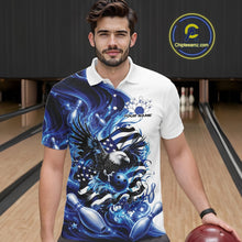 Load image into Gallery viewer, Front view male model at the bowling lane wearing a white and blue bowling polo shirt with eagle artwork and flowing flag inspired graphics.