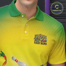 Load image into Gallery viewer, Close-up left chest detail of green and yellow bowling polo shirt featuring autism puzzle bowling ball and pins emblem design