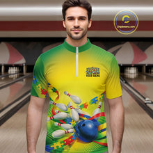 Load image into Gallery viewer, Male model in a bowling lane wearing a green and yellow quarter-zip shirt, autism puzzle bowling ball and pins with vibrant colorful illustration.
