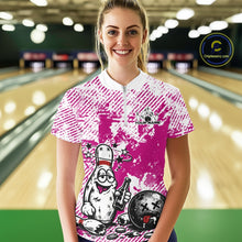 Load image into Gallery viewer, Front view female model in pink and white bowling quarter zip shirt inside bowling lane, playful bowling pin beer drinking graphic artwork