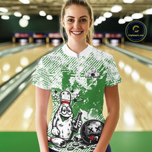 Load image into Gallery viewer, Front view female model wearing green and white bowling quarter zip shirt in bowling lane, playful cartoon bowling pin drinking beer graphic design