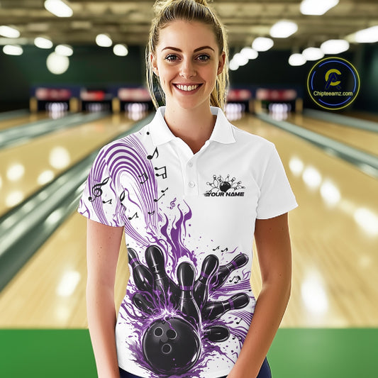 Female model wearing a white and purple bowling polo shirt at the bowling lane with musical bowling artwork and flowing note accents.