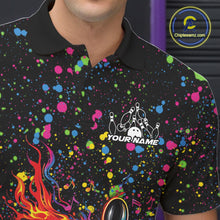 Load image into Gallery viewer, Left chest close-up of a black bowling polo shirt displaying flaming bowling artwork with colorful paint splatters.