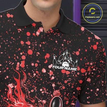 Close-up left chest detail of a black bowling polo shirt featuring flaming bowling graphics with red paint splashes.