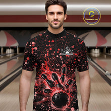 Load image into Gallery viewer, Male model wearing a black bowling quarter-zip shirt at the bowling lane with red splatter details and bowling strike graphics.