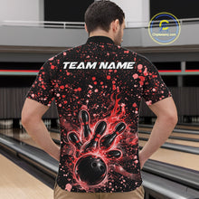 Load image into Gallery viewer, Front view of a male model in a black bowling quarter-zip shirt showcasing fiery bowling artwork and red paint splashes.