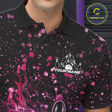 Load image into Gallery viewer, Left chest close-up of a black bowling polo shirt featuring flaming bowling artwork with pink and purple paint splatter details.