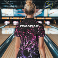 Load image into Gallery viewer, Back view of a female model in a black bowling quarter-zip shirt displaying bowling strike graphics with pink and purple paint splatters.