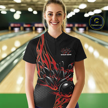 Load image into Gallery viewer, Female model front view inside bowling center wearing black quarter zip shirt featuring red flame bowling ball knocking down pins artwork