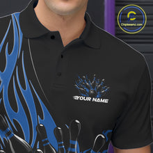 Load image into Gallery viewer, Close-up view of the left chest area of a black bowling polo shirt showing a blue flaming black bowling ball and pins design detail.