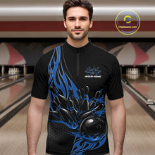 Load image into Gallery viewer, Male model seen front view inside bowling center wearing black quarter zip shirt with blue flaming bowling ball knocking down pins in vivid motion scene.