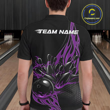 Load image into Gallery viewer, Male model seen from the back in a bowling lane wearing a black polo shirt featuring a purple flaming black bowling ball striking pins in a dynamic motion design.