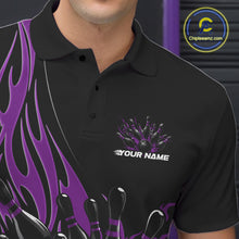 Load image into Gallery viewer, Close-up view of the left chest area of a black bowling polo shirt showing a purple flaming black bowling ball and pins design detail.