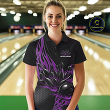 Load image into Gallery viewer, Female model front view at a bowling lane wearing a black polo shirt with a purple flaming black bowling ball striking pins in a dynamic action scene.