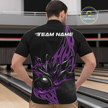Load image into Gallery viewer, Front view of male model at bowling lane wearing black quarter zip shirt with purple flame bowling ball hitting pins in bold athletic motion artwork.