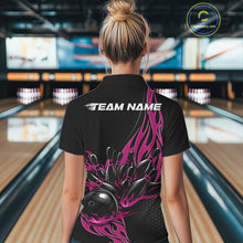 Load image into Gallery viewer, Back view female model at bowling lane wearing black quarter zip shirt with pink flaming bowling ball striking pins dynamic graphics