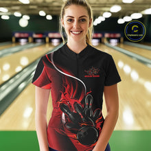 Load image into Gallery viewer, Female model front view at bowling lane wearing black and red quarter zip shirt with flame bowling strike themed graphics