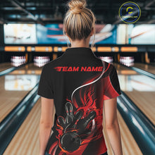 Load image into Gallery viewer, Back view female model inside bowling center wearing black and red quarter zip shirt featuring flaming bowling ball hitting pins design