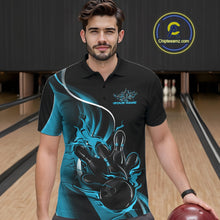 Load image into Gallery viewer, Male model seen from the front in a bowling lane wearing a black and blue polo shirt featuring a flame bowling ball striking pins in a dynamic sports action scene.