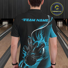 Load image into Gallery viewer, Male model seen from the back in a bowling lane wearing a black and blue polo shirt featuring a flame bowling ball striking pins in a dynamic motion scene.