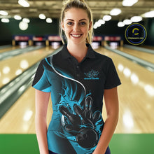 Load image into Gallery viewer, Female model front view in bowling venue wearing black and blue polo shirt with flaming bowling ball knocking down pins in energetic action scene.