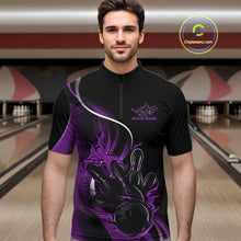 Load image into Gallery viewer, Male model front view inside bowling venue wearing black and purple quarter zip shirt featuring flame bowling action illustration