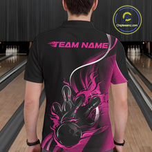 Load image into Gallery viewer, Male model seen from the back in a bowling lane wearing a black and pink polo shirt featuring a flame bowling ball striking pins in a dynamic motion design.