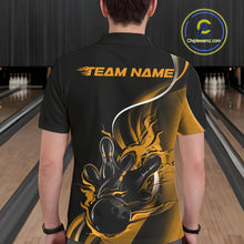 Load image into Gallery viewer, Male model seen from the back in a bowling lane wearing a black and yellow polo shirt featuring a flame bowling ball striking pins in a powerful motion design.