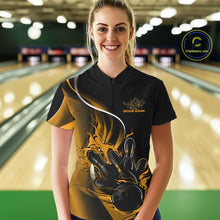 Load image into Gallery viewer, Front view female model in bowling alley wearing black and yellow quarter zip shirt featuring flaming bowling ball striking pins dynamic artwork