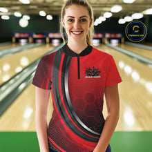 Load image into Gallery viewer, Female model wearing a black and red bowling quarter zip with honeycomb artwork and flaming bowling strike graphics at the bowling lane.