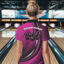 Load image into Gallery viewer, Back view of a female model wearing a black and pink bowling quarter zip with honeycomb accents and flaming bowling ball striking pins artwork in a bowling alley.