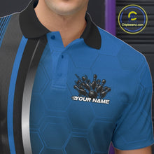 Load image into Gallery viewer, Close-up of the left chest area of a black and blue bowling polo shirt, featuring honeycomb design with a flaming bowling ball striking pins.