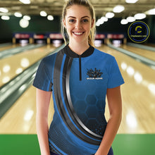 Load image into Gallery viewer, Female model at the bowling lane wearing a black and blue bowling quarter zip with honeycomb artwork and a flaming bowling action scene.