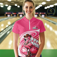 Load image into Gallery viewer, Female model wearing a pink bowling quarter-zip shirt at a bowling lane with a cowboy flamingo and bowling ball artwork.