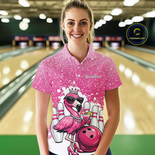 Load image into Gallery viewer, Female model wearing a pink bowling polo shirt at a bowling lane with a crowned flamingo, cocktail, bowling ball, and paint splatter graphics.