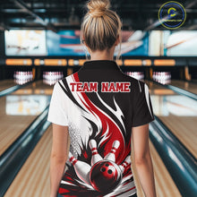 Load image into Gallery viewer, Back view of a female model wearing a white, black, and red bowling quarter zip shirt with a flaming bowling ball and pins graphic at a bowling lane.